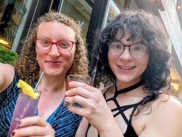 Violet (left) and Velma (right) enjoy cocktails together.